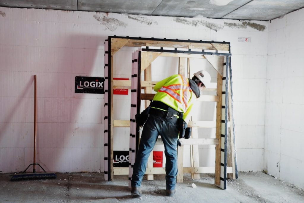 Man Installing ProBuck in a Logix ICF wall, LOgix ICF is the predecessor of Element ICF.