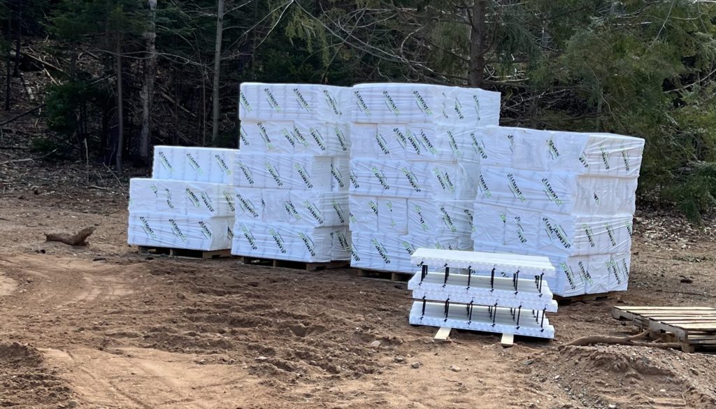 A load of Preformed Element ICF blocks at a job site.