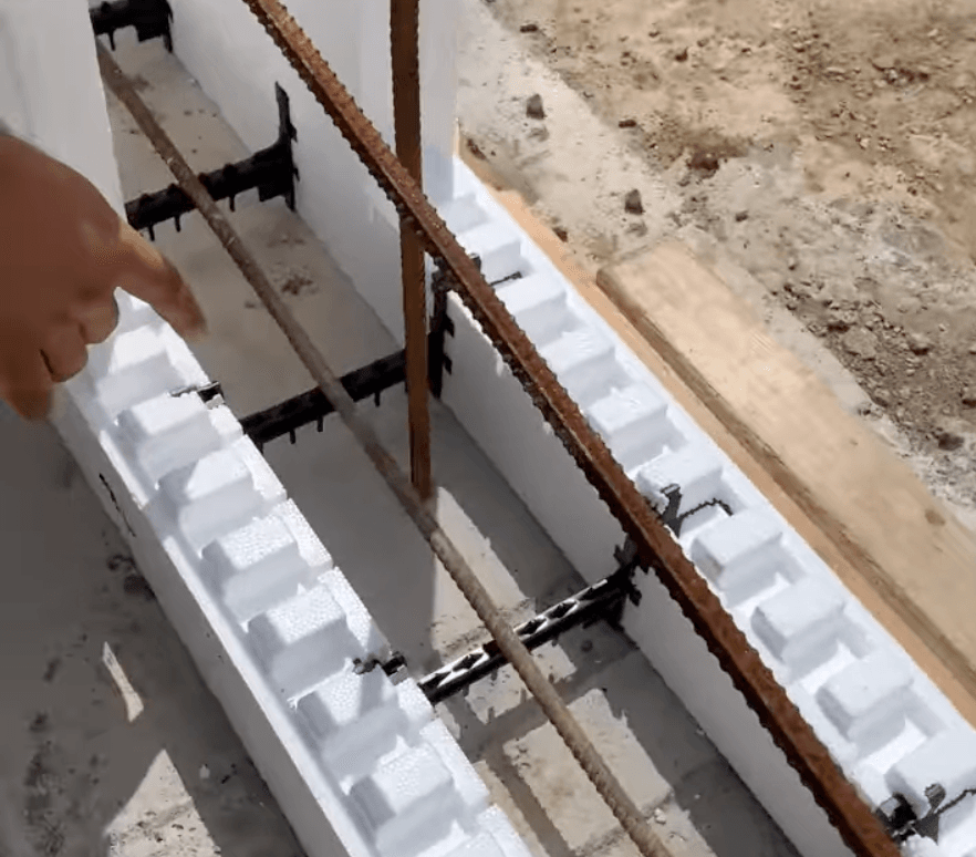 Using the Element ICF site-assembled block, Devon ripped down a standard panel, snapped a Bridging Flextie in half, and locked it in.