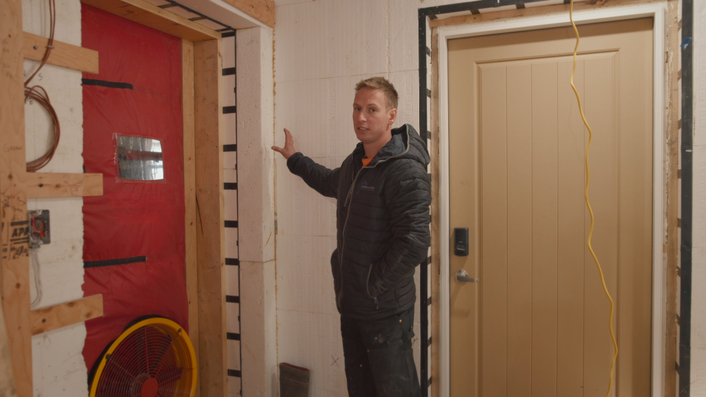 To prevent thermal bridging, the garage structure is connected beyond the continuous insulation layer rather than directly to the ICF wall.