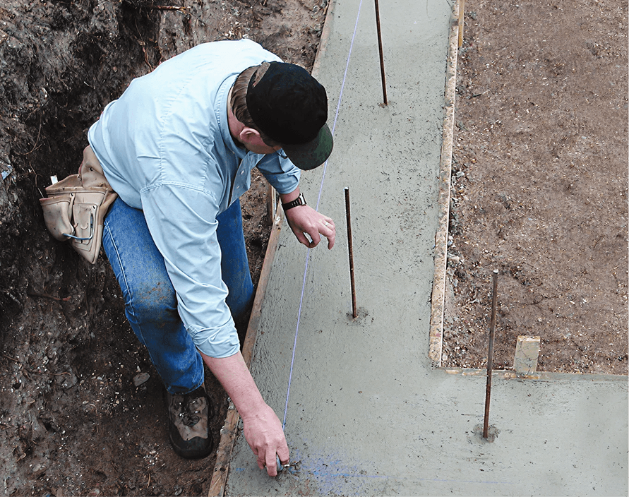Crew member preparing a foundation job site for Element ICF installation