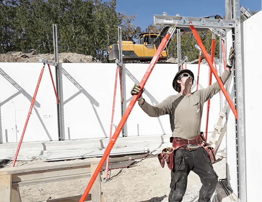 Worker bracing an Element ICF wall before concrete placement